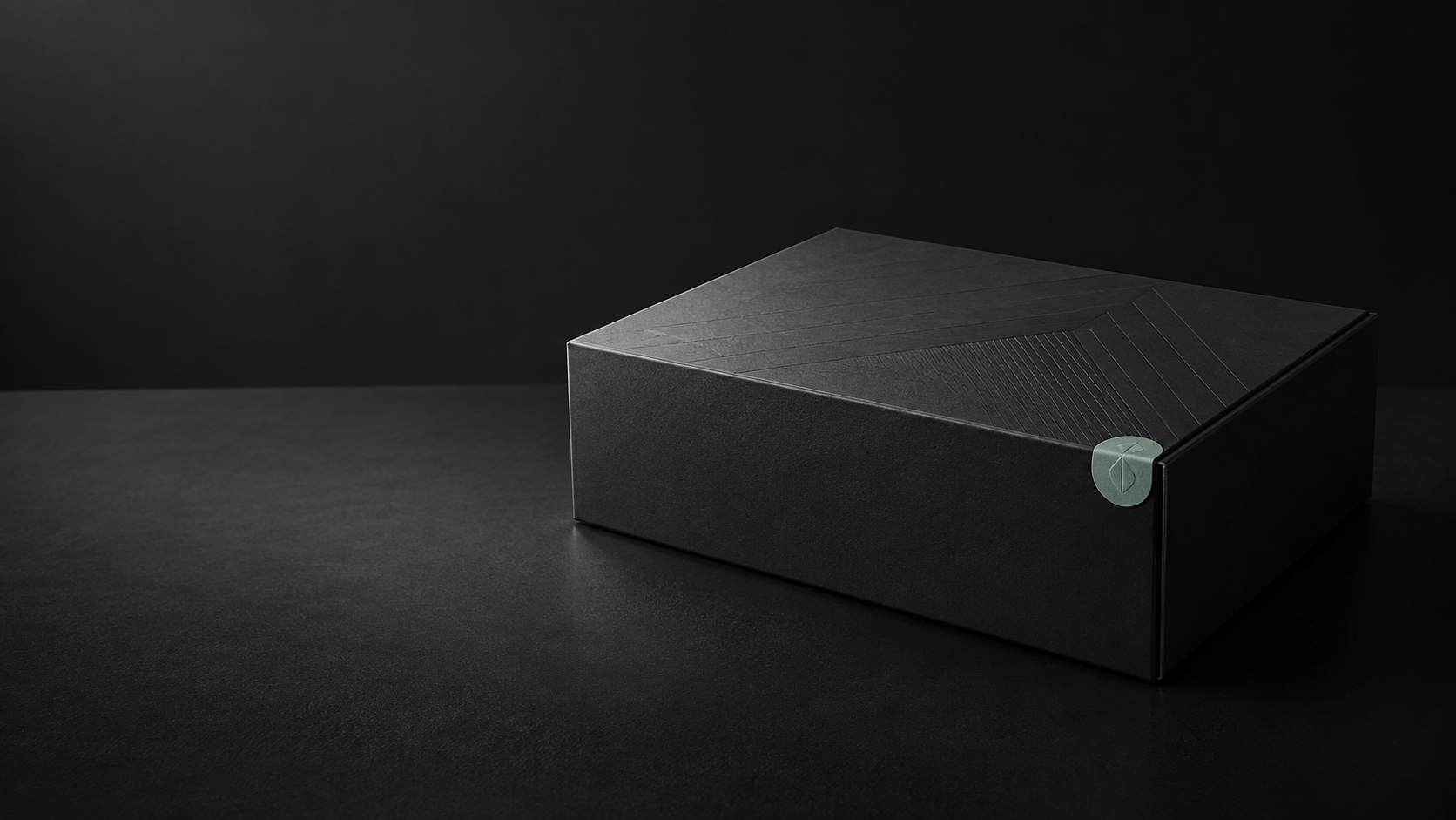 Matte black collector package with a small muted mint seal